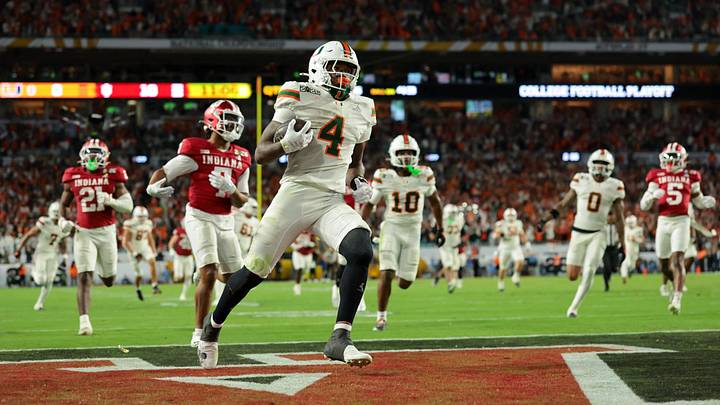 Jan 19, 2026; Miami Gardens, FL, USA; Miami Hurricanes running back Mark Fletcher Jr. (4) carries the ball for a touchdown against the Indiana Hoosiers in the third quarter during the College Football Playoff National Championship game at Hard Rock Stadium. Mandatory Credit: Sam Navarro-Imagn Images