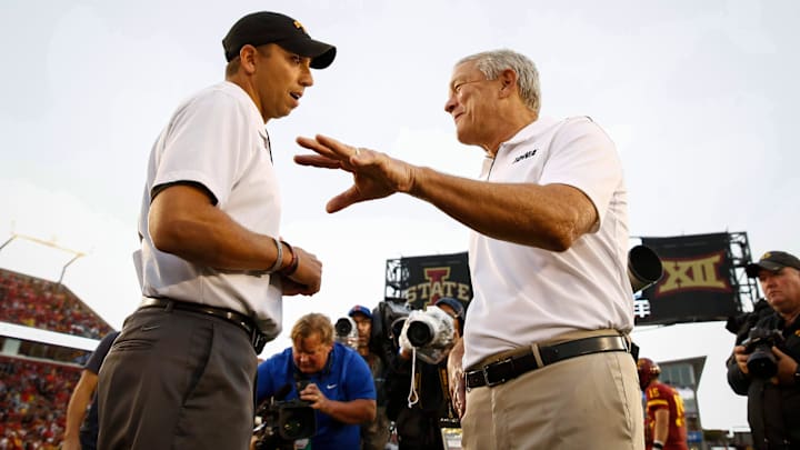 Iowa head football coach Kirk Ferentz, right, meets with Iowa State head football coach Matt Campbell prior to kickoff on Saturday, Sept. 14, 2019, at Jack Trice Stadium in Ames.

20190914 Cyhawkfootball