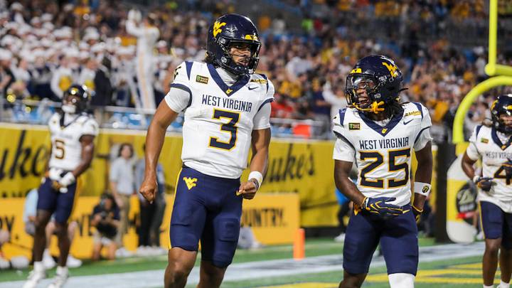 Sep 19, 2026; Charlotte, North Carolina, USA;  West Virginia Mountaineers quarterback Michael Hawkins Jr. (3) celebreates with West Virginia Mountaineers wide receiver Armoni Weaver-Bomar (25) after a touchdown during the first quarter against the Virginia Cavaliers at Bank of America Stadium.  Mandatory Credit: Ben Queen-Imagn Images