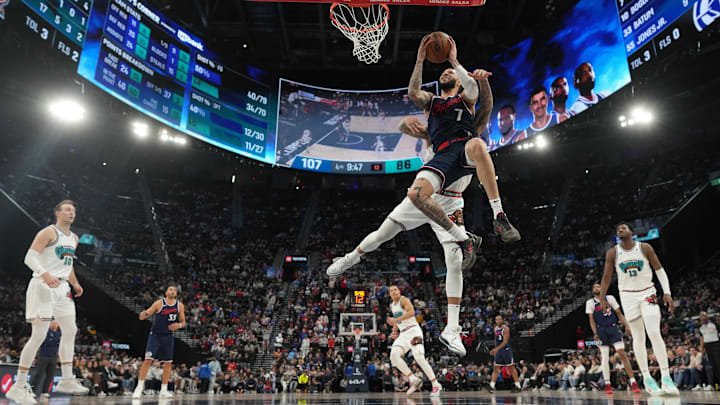 Feb 12, 2025; Inglewood, California, USA; LA Clippers guard Amir Coffey (7) shoots against Memphis Grizzlies forward Jaren Jackson Jr. (13) in the second half at Intuit Dome.