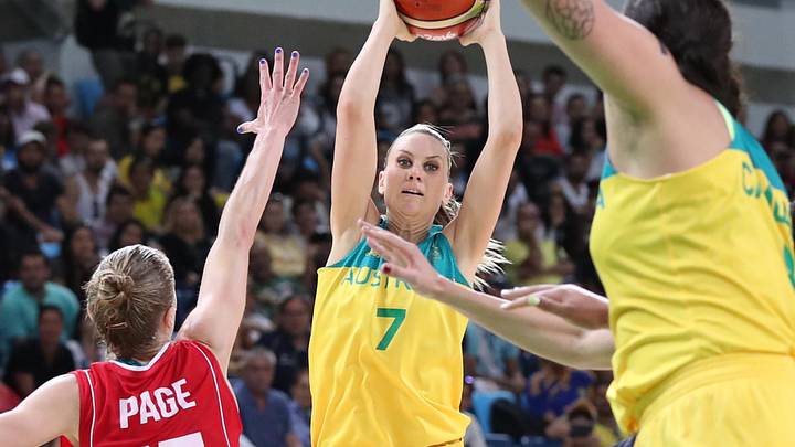 Aug 16, 2016; Rio de Janeiro, Brazil; Australia shooting guard Penny Taylor (7) passes against Serbia power forward Danielle Page (15) in a women's quarterfinal basketball game at Carioca Arena 1 during the Rio 2016 Summer Olympic Games. Mandatory Credit: Geoff Burke-Imagn Images