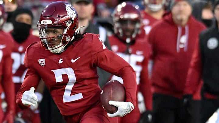 Nov 30, 2024; Pullman, Washington, USA; Washington State Cougars wide receiver Kyle Williams (2) carries the ball against the Wyoming Cowboys in the first half at Gesa Field at Martin Stadium. Mandatory Credit: James Snook-Imagn Images Nov 30, 2024; Pullman, Washington, USA; Washington State Cougars wide receiver Kyle Williams (2) carries the ball against the Wyoming Cowboys in the first half at Gesa Field at Martin Stadium. Mandatory Credit: James Snook-Imagn Images