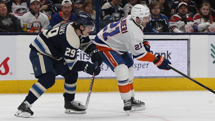 Apr 17, 2025; Columbus, Ohio, USA; New York Islanders center Kyle Palmieri (21) controls the puck as Columbus Blue Jackets right wing Jack Williams (29) defends during the third period at Nationwide Arena. Mandatory Credit: Russell LaBounty-Imagn Images