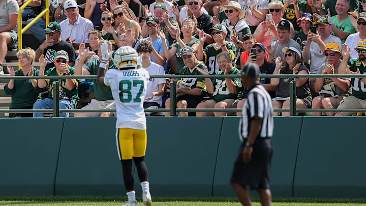 Green Bay Packers receiver Romeo Doubs pumps up the crowd during the 12th practice of training camp on Aug. 6 at Ray Nitschke Field in Ashwaubenon.