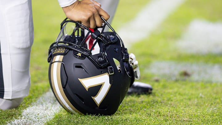 Nov 23, 2024; Baton Rouge, Louisiana, USA;  Detailed view of the Vanderbilt Commodores helmet on the turf against the LSU Tigers during the first half at Tiger Stadium. Mandatory Credit: Stephen Lew-Imagn Images