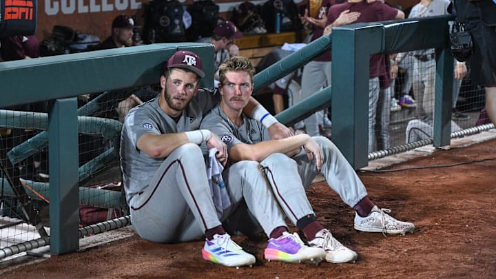 Jun 24, 2024; Omaha, NE, USA; Texas A&M Aggies third baseman Gavin Grahovac (9) and designated hitter Hayden Schott (5) look over the field after the loss against the Tennessee Volunteers at Charles Schwab Field Omaha. Mandatory Credit: Steven Branscombe-Imagn Images Jun 24, 2024; Omaha, NE, USA; Texas A&M Aggies third baseman Gavin Grahovac (9) and designated hitter Hayden Schott (5) look over the field after the loss against the Tennessee Volunteers at Charles Schwab Field Omaha. Mandatory Credit: Steven Branscombe-Imagn Images