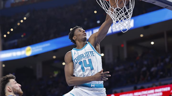 Mar 21, 2025; Oklahoma City, Oklahoma, USA; Charlotte Hornets forward Moussa Diabate (14) dunks against the Oklahoma City Thunder during the second half at Paycom Center. Mandatory Credit: Alonzo Adams-Imagn Images