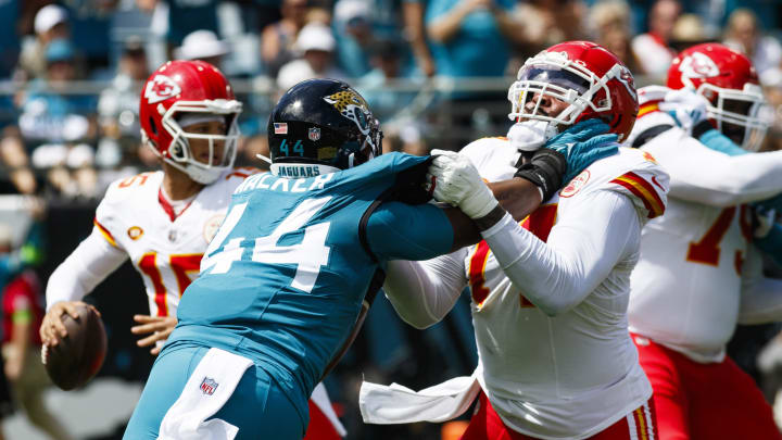 Sep 17, 2023; Jacksonville, Florida, USA; Kansas City Chiefs offensive tackle Lucas Niang (77) blocks outside linebacker Travon Walker (44) from Kansas City Chiefs quarterback Patrick Mahomes (15) during the first quarter at EverBank Stadium. Mandatory Credit: Morgan Tencza-USA TODAY Sports