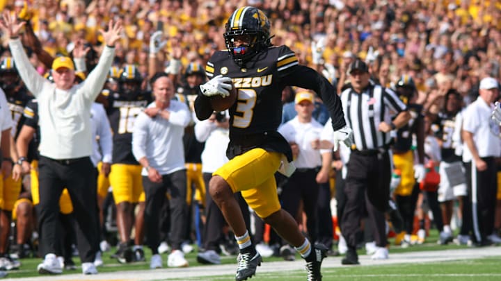 Sep 6, 2025; Columbia, Missouri, USA; Missouri Tigers wide receiver Kevin Coleman Jr. runs the ball short of the end zone against Kansas.