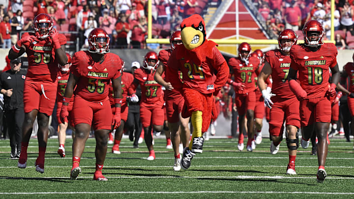 Oct 5, 2024; Louisville, Kentucky, USA;  The Louisville Cardinals take the field before the first quarter against the Southern Methodist Mustangs at L&N Federal Credit Union Stadium. Mandatory Credit: Jamie Rhodes-Imagn Images