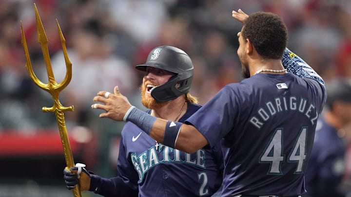 Aug 31, 2024; Anaheim, California, USA; Seattle Mariners first baseman Justin Turner (2) celebrates with center fielder Julio Rodriguez (44) and a pitchfork after hitting a home run in the fourth inning against the Los Angeles Angels at Angel Stadium. Mandatory Credit: Kirby Lee-Imagn Images Aug 31, 2024; Anaheim, California, USA; Seattle Mariners first baseman Justin Turner (2) celebrates with center fielder Julio Rodriguez (44) and a pitchfork after hitting a home run in the fourth inning against the Los Angeles Angels at Angel Stadium. Mandatory Credit: Kirby Lee-Imagn Images