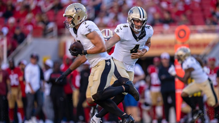 New Orleans Saints quarterback Derek Carr (4) hands the football off to Taysom Hill (7)