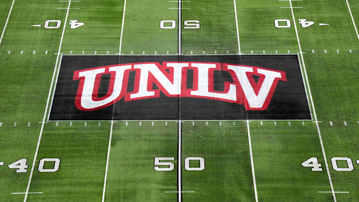 The UNLV Rebels logo at midfield during the Mountain West Championship at Allegiant Stadium. Mandatory Credit: Kirby Lee-Imagn Images The UNLV Rebels logo at midfield during the Mountain West Championship at Allegiant Stadium. Mandatory Credit: Kirby Lee-Imagn Images