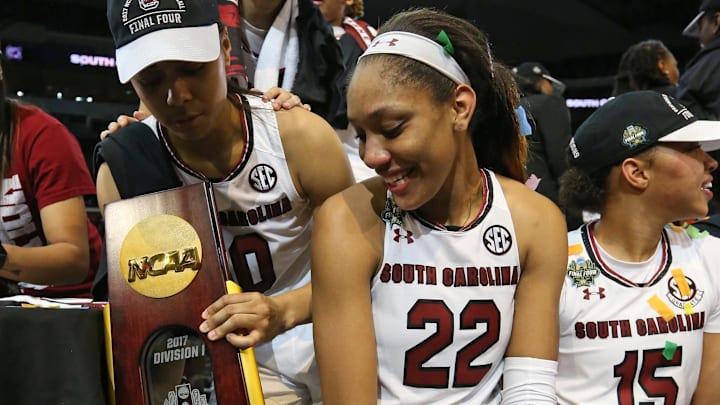 Apr 2, 2017; Dallas, TX, USA; South Carolina Gamecocks forward A'ja Wilson (22) and guard Tiffany Davis (15) and guard Allisha Gray (10) celebrate on the podium after defeating the Mississippi State Lady Bulldogs in the 2017 Women's Final Four championship at American Airlines Center. Mandatory Credit: Matthew Emmons-Imagn Images