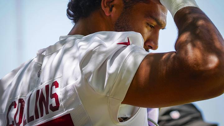 Cardinals linebacker Zaven Collins (25) wipes his forehead in the shade during organized team activities at the Cardinals Training Facility in Tempe on May 27, 2026.
