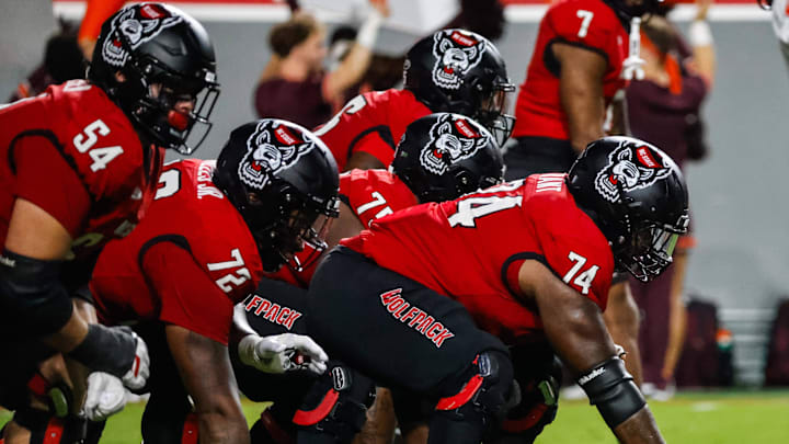 Sep 27, 2025; Raleigh, North Carolina, USA; North Carolina State Wolfpack offensive lineman Jalen Grant (74) with the ball during the first half of the game against Virginia Tech Hokies at Carter-Finley Stadium. Mandatory Credit: Jaylynn Nash-Imagn Images Sep 27, 2025; Raleigh, North Carolina, USA; North Carolina State Wolfpack offensive lineman Jalen Grant (74) with the ball during the first half of the game against Virginia Tech Hokies at Carter-Finley Stadium. Mandatory Credit: Jaylynn Nash-Imagn Images