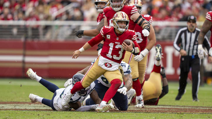 November 17, 2024; Santa Clara, California, USA; San Francisco 49ers quarterback Brock Purdy (13) runs the football against the Seattle Seahawks during the third quarter at Levi's Stadium. Mandatory Credit: Kyle Terada-Imagn Images
