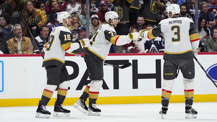 Apr 8, 2025; Denver, Colorado, USA; Vegas Golden Knights center William Karlsson (71) celebrates his goal scored with right wing Reilly Smith (19) and defenseman Brayden McNabb (3) in the first period against the Colorado Avalanche at Ball Arena. Mandatory Credit: Ron Chenoy-Imagn Images