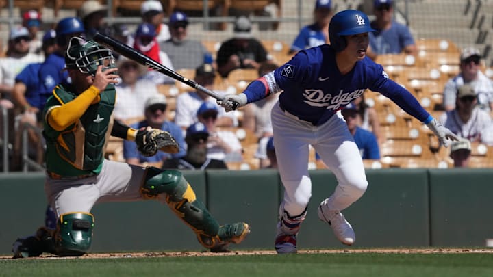 Mar 21, 2026; Phoenix, Arizona, USA; Los Angeles Dodgers second baseman Hyeseong Kim (6) hits against the Athletics in the first inning at Camelback Ranch-Glendale. Mandatory Credit: Rick Scuteri-Imagn Images