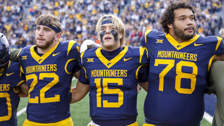 Nov 8, 2025; Morgantown, West Virginia, USA; West Virginia Mountaineers quarterback Scotty Fox Jr. (15) sings “Country Roads” after defeating the Colorado Buffaloes at Milan Puskar Stadium. Mandatory Credit: Ben Queen-Imagn Images