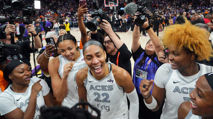 Oct 10, 2025; Phoenix, Arizona, USA; Las Vegas Aces center A'ja Wilson (22) celebrates with teammates after game four of the 2025 WNBA Finals at Mortgage Matchup Center. Mandatory Credit: Joe Camporeale-Imagn Images