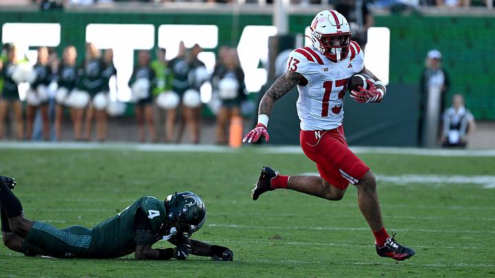 Sep 26, 2026; East Lansing, Michigan, USA; Nebraska Cornhuskers running back Mekhi Nelson (13) runs from Michigan State Spartans defensive back Charles Brantley (4) during the second quarter at Spartan Stadium. Mandatory Credit: Dale Young-Imagn Images Sep 26, 2026; East Lansing, Michigan, USA; Nebraska Cornhuskers running back Mekhi Nelson (13) runs from Michigan State Spartans defensive back Charles Brantley (4) during the second quarter at Spartan Stadium. Mandatory Credit: Dale Young-Imagn Images