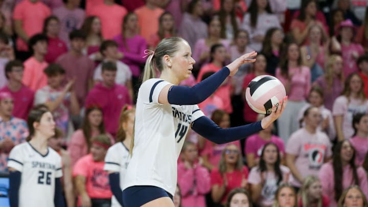 Pleasant Valley's Isabelle Kremer (14) prepares to serve to Waukee Northwest in the Class 5A state volleyball championship Thursday, Nov. 7, 2024 at Xtream Arena in Coralville, Iowa.