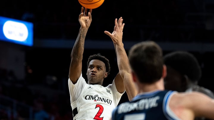 Cincinnati Bearcats guard Jizzle James (2) hits a 3-point basket in the second half of the NCAA Basketball game at Fifth Third Arena in Cincinnati on Tuesday, March 3, 2026.