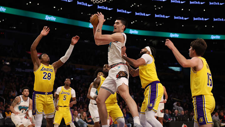 Memphis Grizzlies center Zach Edey (14) rebounds a ball Memphis Grizzlies center Zach Edey (14) rebounds a ball