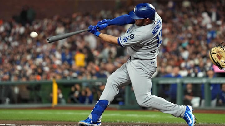 Sep 12, 2025; San Francisco, California, USA; Los Angeles Dodgers third baseman Max Muncy (13) hits a single against the San Francisco Giants during the sixth inning at Oracle Park. Mandatory Credit: Darren Yamashita-Imagn Images