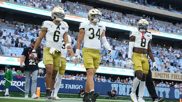 Oct 3, 2026; Chapel Hill, North Carolina, USA; Notre Dame Fighting Irish wide receiver Jordan Faison (6) and linebacker Drayk Bowen (34) and safety Adon Shuler (8) walk on to the field at Kenan Stadium. Mandatory Credit: Bob Donnan-Imagn Images Oct 3, 2026; Chapel Hill, North Carolina, USA; Notre Dame Fighting Irish wide receiver Jordan Faison (6) and linebacker Drayk Bowen (34) and safety Adon Shuler (8) walk on to the field at Kenan Stadium. Mandatory Credit: Bob Donnan-Imagn Images
