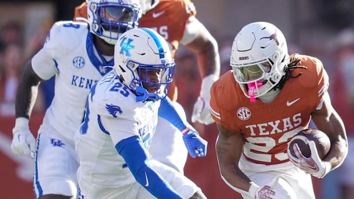 Texas Longhorns running back Jaydon Blue (23) looks for room to run against Kentucky Wildcats defensive back Jordan Lovett (25) in the first quarter of an NCAA college football game at Darrell K Royal Texas Memorial Stadium, Austin, Texas, Saturday, Nov 24, 2024. Blue, who attended Klein Cain High School, is one of 30 Texas prep products who were picked in the first six rounds of the 2025 NFL Draft. Blue was selected by the Dallas Cowboys. 