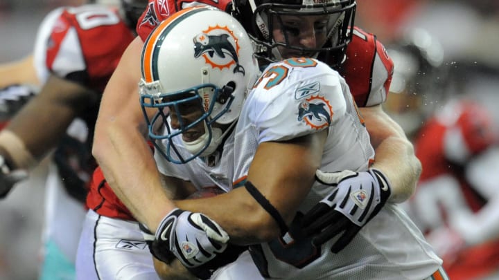 Miami Dolphins fullback Lousaka Polite carries the ball against the Atlanta Falcons during the 2009 regular season opener. Miami Dolphins fullback Lousaka Polite carries the ball against the Atlanta Falcons during the 2009 regular season opener.