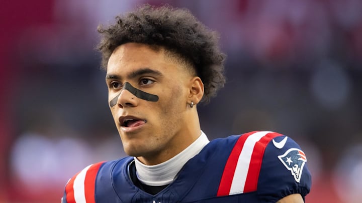 Dec 15, 2024; Glendale, Arizona, USA; New England Patriots cornerback Christian Gonzalez (0) against the Arizona Cardinals at State Farm Stadium. Mandatory Credit: Mark J. Rebilas-Imagn Images