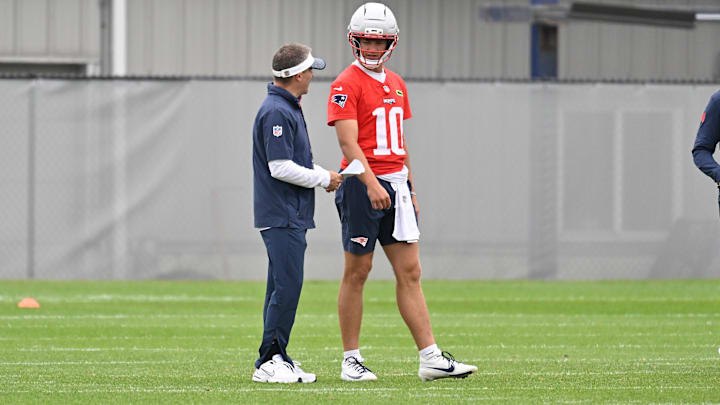 Jun 9, 2025; Foxborough, MA, USA; New England Patriots offensive coordinator Josh McDaniels works with quarterback Drake Maye (10) during minicamp at Gillette Stadium. Mandatory Credit: Eric Canha-Imagn Images