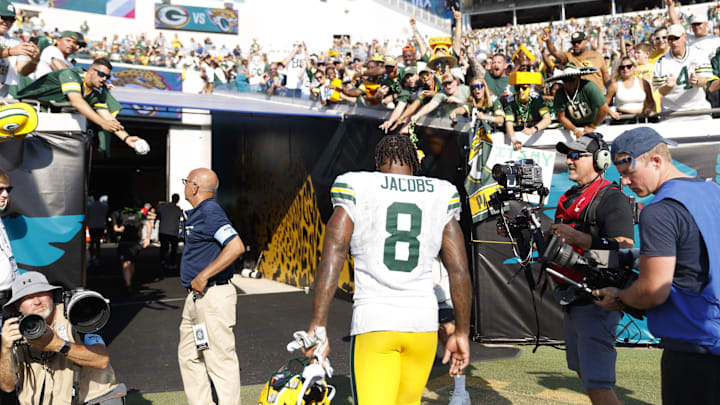 Green Bay Packers running back Josh Jacobs is saluted by fans after Sunday's win at the Jacksonville Jaguars.