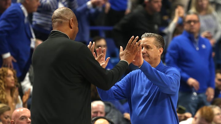 Kentucky   s John Calipari and Louisville   s Kenny Payne hug each other at the end of the game.Dec.