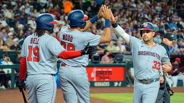 May 31, 2025; Phoenix, Arizona, USA; Washington Nationals infielder Josh Bell (19) outfielder James Wood (29) and infielder Nathaniel Lowe (33) celebrate after Wood and Lowe score the second and third run of the first inning against the Arizona Diamondbacks at Chase Field. May 31, 2025; Phoenix, Arizona, USA; Washington Nationals infielder Josh Bell (19) outfielder James Wood (29) and infielder Nathaniel Lowe (33) celebrate after Wood and Lowe score the second and third run of the first inning against the Arizona Diamondbacks at Chase Field.