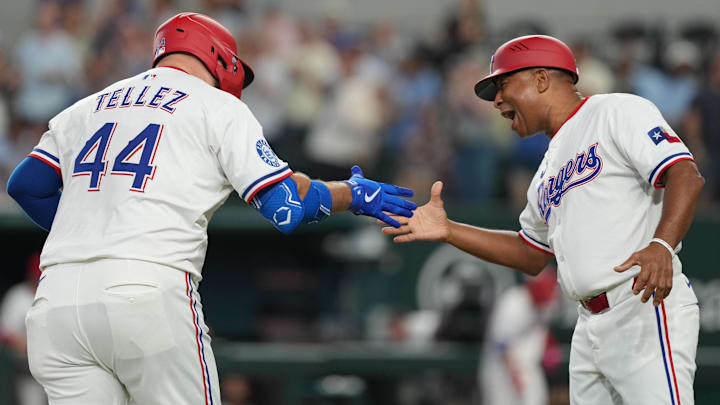 Jul 19, 2025; Arlington, Texas, USA;  Texas Rangers first baseman Rowdy Tellez (44) celebrates his three-run home run with third base coach Tony Beasley (27) against the Detroit Tigers during the second inning at Globe Life Field. 