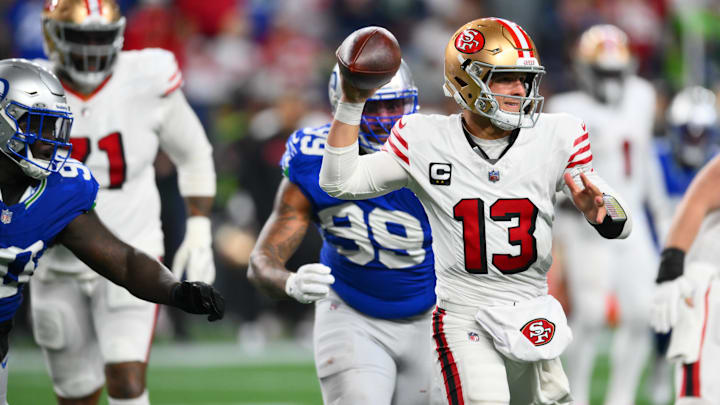 Oct 10, 2024; Seattle, Washington, USA; San Francisco 49ers quarterback Brock Purdy (13) passes the ball against the Seattle Seahawks during the second half at Lumen Field. 