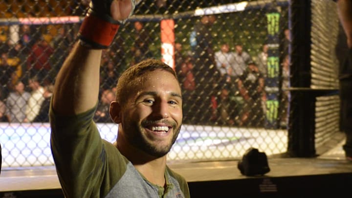 Apr 4, 2015; Fairfax, VA, USA; Chad Mendes (red gloves) celebrates after the first round of technical knock out against Richardo Lamas (not pictured) during UFC Fight Night at Patriot Center. Mandatory Credit: Tommy Gilligan-Imagn Images