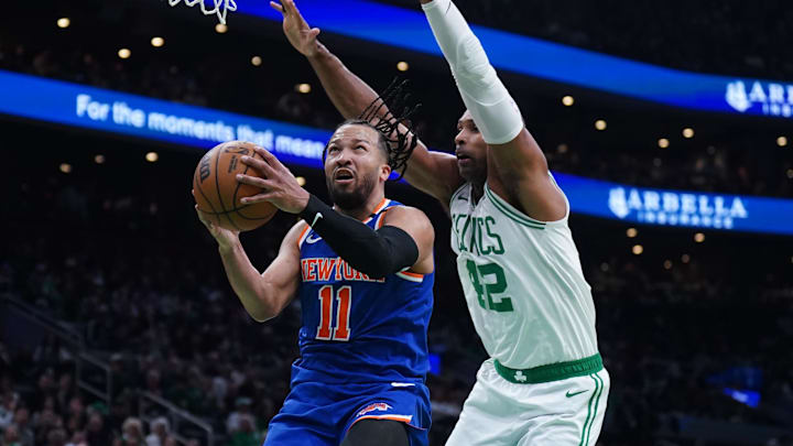May 5, 2025; Boston, Massachusetts, USA; New York Knicks guard Jalen Brunson (11) drives the ball to the basket against Boston Celtics center Al Horford (42) in the second quarter during game one of the second round for the 2025 NBA Playoffs at TD Garden. Mandatory Credit: David Butler II-Imagn Images