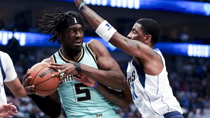 Feb 27, 2025; Dallas, Texas, USA; Charlotte Hornets center Mark Williams (5) controls the ball as Dallas Mavericks guard Kyrie Irving (11) defends during the first half at American Airlines Center. Mandatory Credit: Kevin Jairaj-Imagn Images Feb 27, 2025; Dallas, Texas, USA; Charlotte Hornets center Mark Williams (5) controls the ball as Dallas Mavericks guard Kyrie Irving (11) defends during the first half at American Airlines Center. Mandatory Credit: Kevin Jairaj-Imagn Images