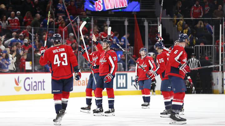 Dec 9, 2023; Washington, District of Columbia, USA; Washington Capitals players celebrate on the ice