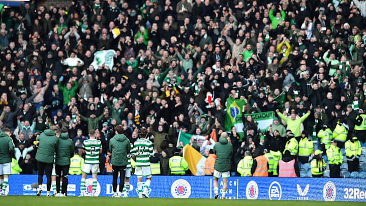 Celtic's players applaud their famously fervent support