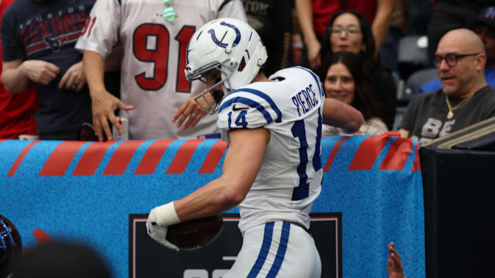 Jan 4, 2026; Houston, Texas, USA;  Indianapolis Colts wide receiver Alec Pierce (14) reacts after catching a touchdown against the Houston Texans during the first half at NRG Stadium. Mandatory Credit: Thomas Shea-Imagn Images