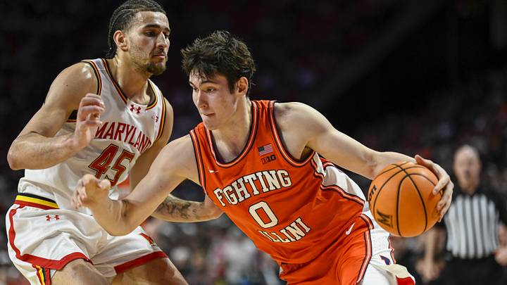 Mar 8, 2026; College Park, Maryland, USA;  Illinois Fighting Illini forward David Mirkovic (0) drives to the basket on Maryland Terrapins center Collin Metcalf (45) during the first half at Xfinity Center. Mandatory Credit: Tommy Gilligan-Imagn Images
