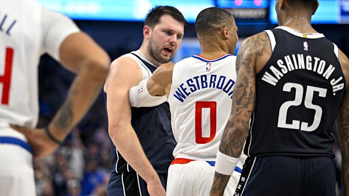 Apr 26, 2024; Dallas, Texas, USA; LA Clippers guard Russell Westbrook (0) shoves Dallas Mavericks