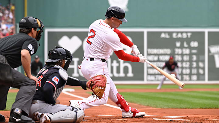 Sep 1, 2025; Boston, Massachusetts, USA; Boston Red Sox third baseman Alex Bregman (2) hits a double during the first inning against the Cleveland Guardians at Fenway Park. Mandatory Credit: Eric Canha-Imagn Images