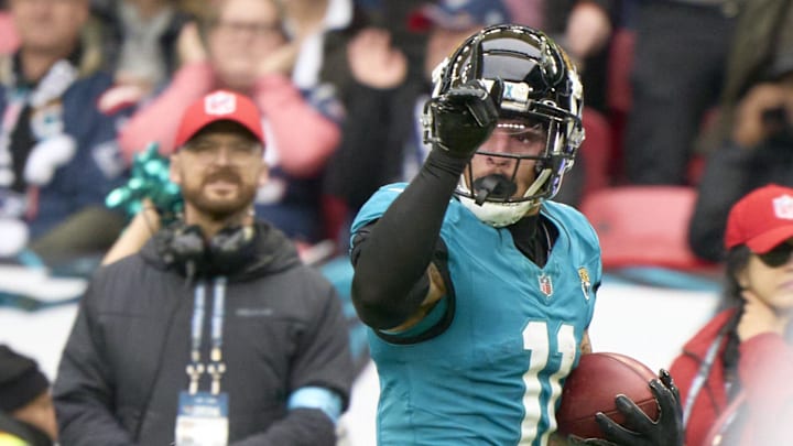 Oct 20, 2024; London, United Kingdom; Jacksonville Jaguars wide receiver Parker Washington (11) runs in a 96 yard touchdown in the first half during an NFL International Series game at Wembley Stadium. Mandatory Credit: Peter van den Berg-Imagn Images